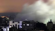 Smoke billows following an Israeli strike in Rafah in the southern Gaza Strip on December 8, 2023. (Photo by Mahmud Hams / AFP)