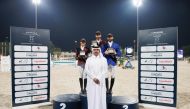 The podium winners of Big Tour pose for a photo with Head of Qatar Equestrian Teams Abdullah Al Marri after the presentation. 
