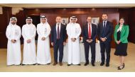 QIIB CEO Dr. Abdulbasit Ahmed Al Shaibei, Mastercard Division President, Middle East & North Africa Khalid Elgibali with other officials during the MoU signing.