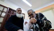 An Egyptian man casts his ballot during the presidential election, at a polling station in downtown Cairo on December 10, 2023. (Photo by Khaled Desouki / AFP)