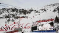 FIS and resort employees gather to dismantle the slope structures as the Men's Slalom event of the FIS Alpine Ski World Championship 2023 in Val d'Isere is cancelled on December 10, 2023. (Photo by Jeff Pachoud / AFP)