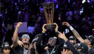 LeBron James of the Los Angeles Lakers hoists the trophy with his teammates after winning the championship game of the inaugural NBA In-Season Tournament at T-Mobile Arena on December 09, 2023 in Las Vegas, Nevada. (Photo by Ethan Miller / Getty Images via AFP)