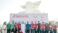 Officials pose for a photograph after the ‘Ride for Education 2023’ cycling event at the Sheraton Grand Doha Resort & Convention Hotel.