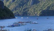 This photo taken on December 11, 2023 shows tour boats sailing back to El Nido, Palawan province. (Photo by Ted ALJIBE / AFP)
