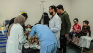 An injured Palestinian girls receives treatment at the Kuwait hospital following Israeli bombardment in Rafah, in the southern Gaza Strip yesterday.  (AFP)