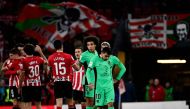 Atletico Madrid's Argentinian forward #10 Angel Correa and teammates react to their defeat at the end of the Spanish league football match between Athletic Club Bilbao and Club Atletico de Madrid at the San Mames stadium in Bilbao on December 16, 2023. (Photo by ANDER GILLENEA / AFP)
