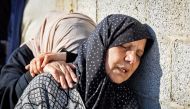 Relatives mourn during the funeral of Al Jazeera cameraman Samer Abu Daqqa, who was killed during Israeli bombardment, in Khan Yunis, Gaza Strip, yesterday.