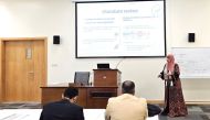 Students and faculty at QU’s College of Health Sciences discuss graduation projects.