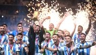 Argentina's Lionel Messi lifts the World Cup trophy during the Qatar 2022 World Cup trophy ceremony at Lusail International Stadium, in this December 18, 2022 file photo. AFP