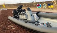 This handout photo taken in an undisclosed place and released on December 22, 2023 by Spain's Guardia Civil shows a speed boat loaded with parcels, seized as part of a drug trafficking investigation led simultaneously in Spain and Portugal and coordinated by Europol. (Photo by Spanish Guardia Civil / AFP)