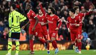 Liverpool's Egyptian striker #11 Mohamed Salah celebrates after scoring his team first goal during the English Premier League football match between Liverpool and Arsenal at Anfield in Liverpool, north west England on December 23, 2023. (Photo by Paul ELLIS / AFP)