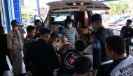 A Chinese worker who was injured in the explosion at a nickel smelter furnace is brought to the Morowali Regional General Hospital in Central Sulawesi on December 24, 2023. Photo by AFP

