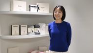 This picture taken on November 29, 2023 shows Erin Lim, CEO of baby products company Konny, posing with baby goods after an interview with AFP at her company's new office in Seoul. Photo by Jung Yeon-je / AFP