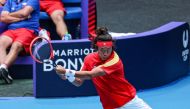 Zhang Zhizhen (top) and Zheng Qinwen hit a return against Czech Republic Jiri Lehecka and Marketa Vondrousova during their mixed doubles match at the United Cup tennis tournament in Perth on December 30, 2023. (Photo by COLIN MURTY / AFP)