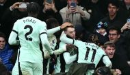 Chelsea's English midfielder #20 Cole Palmer (C) celebrates with Chelsea fans after scoring their third goal during the English Premier League football match between Luton Town and Chelsea at Kenilworth Road in Luton, north of London on December 30, 2023. (Photo by Ben Stansall / AFP)