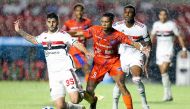 (FILES) Sao Paulo's defender Lucas Beraldo (L) and Puerto Cabello's midfielder Luifer Hernandez vie for the ball during the Copa Sudamericana group stage first leg football match between Sao Paulo and Academia Puerto Cabello at the Morumbi stadium in Sao Paulo, Brazil, on April 18, 2023. (Photo by Paulo Pinto / AFP)

