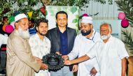 Sri Lankan Ambassador to Qatar H E Mafaz Mohideen (centre) with other officials during the event.