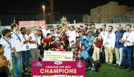 The winning team with the trophy.