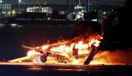 This photo provided by Jiji Press shows a Japan Airlines plane on fire on a runway of Tokyo's Haneda Airport on January 2, 2024. (Photo by Jiji Press / AFP) 