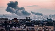 Smoke billows during Israeli bombardment on Khan Yunis from Rafah in the southern Gaza Strip early on January 3, 2024. (Photo by AFP)