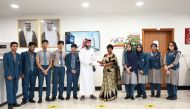 MES Indian School Abu Hamour Branch Principal Pramila Kannan handing over funds to a Qatar Charity representative.