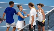 Germany's Laura Siegemund (R) and Alexander Zverev (2nd R) shake hands with Greece's Maria Sakkari and Petros Tsitsipas after victory during their mixed-doubles match at the United Cup tennis event on Ken Rosewall Arena in Sydney on January 5, 2024. Photo by DAVID GRAY / AFP