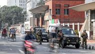 Army soldiers patrol outside the state secretariat in Dhaka on January 6, 2024 on the eve of Bangladesh's general elections. (Photo by Munir UZ ZAMAN / AFP)