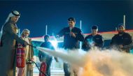 Youngsters receiving fire fighting training at Al Enna camp in Sealine.