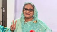 Bangladesh's Prime Minister Sheikh Hasina gestures after casting her vote casts at a polling station in Dhaka on January 7, 2024. (Photo by AFP)

