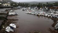 A photo shows damages and boats in a marina after the passage of cyclone Belal in Saint-Paul, on the French Indian Ocean island of La Reunion, on January 15, 2024. (Photo by Richard Bouhet / AFP)