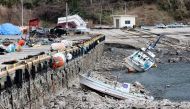 This photograph provided by Jiji Press and taken on January 12, 2024 shows the exposed ocean floor at Kaiso Port in Wajima city, Ishikawa prefecture in the after a 7.5 magnitude earthquake struck the Noto region in Ishikawa prefecture on New Year's Day. Photo by JIJI PRESS / AFP