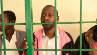(FILES) Self-proclaimed pastor Paul Nthenge Mackenzie, (C) who set up the Good News International Church in 2003 and is accused of inciting cult followers to starve to death 