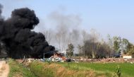 Handout released on January 17, 2024, shows smoke rising after an explosion at a fireworks factory near Sala Khao township in Thailand's Suphan Buri province. (Photo by Handout / Thailand's Novice Kaew Suphanburi Highway Rescue Association / AFP) 