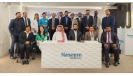 Officials of Qatar Cricket Association and Naseem Al Rabeeh Healthcare Group pose for a group photo.