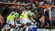 Nigeria's players celebrate after winning at the end of the Africa Cup of Nations (CAN) 2024 group A football match between Ivory Coast and Nigeria at the Alassane Ouattara Olympic Stadium in Ebimpe, Abidjan, on January 18, 2024. (Photo by Franck Fife / AFP)
