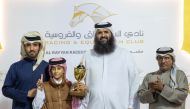 Ambassador of the State of Qatar to Bosnia and Herzegovina H E Meshaal bin Ali Al Attiyah (third left) with the connections of Toromona after the Awajan K A Al Khayarin-owned horse won the Khor Al Adaid Cup at QREC's 23rd Al Rayyan Meeting.