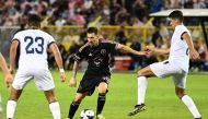 Inter Miami's Argentine forward #10 Lionel Messi vies for the ball with El Salvador's midfielder Melvin Cartagena #23 and El Salvador's defender #02 Julio Sibrian in San Salvador, El Salvador, on January 19, 2024. (Photo by Marvin Recinos / AFP)