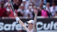 Italy's Jannik Sinner celebrates after victory against Serbia's Novak Djokovic in Melbourne on January 26, 2024. (Photo by Martin Keep / AFP)