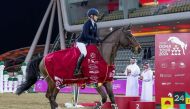 Evelina Tovek celebrates with 12-year-old gelding Moeboetoe v/D Roshoeve after her victory at the Doha Tour International Equestrian Championship yesterday.