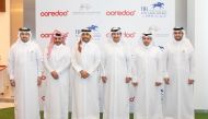 Officials of Ooredoo Qatar and Qatar Racing and Equestrian Club pose for a photograph following the sponsorship signing ceremony.