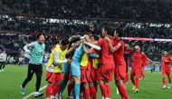 South Korea players celebrate their Round of 16 victory against Saudi Arabia.