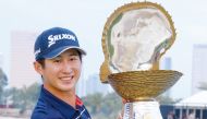 Japan’s Rikuya Hoshino poses with the Mother of Pearl trophy.