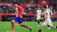 Atletico Madrid's Spanish forward #19 Alvaro Morata (L) is challenged by Sevilla's Spanish midfielder #16 Jesus Navas during the Spanish league football match between Sevilla FC and Club Atletico de Madrid at the Ramon Sanchez Pizjuan stadium in Seville on February 11, 2024. (Photo by CRISTINA QUICLER / AFP)