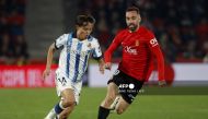 Real Sociedad's Japanese forward #14 Takefusa Kubo (L) vies with Real Mallorca’s Spanish midfielder #10 Sergi Darder during the Spanish Copa del Rey (King's Cup) semi final first leg football match between RCD Mallorca and Real Sociedad at the Mallorca Son Moix stadium in Palma de Mallorca on February 6, 2024. (Photo by JAIME REINA / AFP)