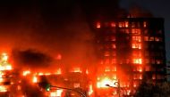 A huge fire rages through a multistorey residential block in Valencia on February 22, 2024. Photo by Jose Jordan / AFP