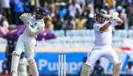 England's Joe Root (R) plays a shot during the second day of the fourth Test cricket match between India and England at the Jharkhand State Cricket Association (JSCA) Stadium in Ranchi on February 24, 2024. (Photo by Tauseef Mustafa / AFP)