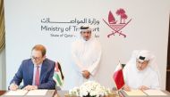 Minister of Transport H E Jassim Saif Ahmed Al Sulaiti looks on as QCAA's Mohammed Faleh Al Hajri (right) and Chairman of the Board of Commissioners of Jordan's CARC, H E Captain Haitham Misto sign a protocol.