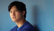 Shohei Ohtani #17 of the Los Angeles Dodgers looks on in the dugout during a game against the Chicago White Sox at Camelback Ranch on February 27, 2024 in Glendale, Arizona. Christian Petersen/Getty Images/AFP