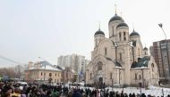 Mourners crowd outside the Mother of God Quench My Sorrows church ahead of a funeral service for late Russian opposition leader Alexei Navalny, in Moscow's district of Maryino on March 1, 2024. (Photo by STRINGER / AFP)
