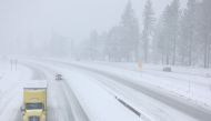 Vehicles drive on I-80 as Snow falls north of Lake Tahoe in the Sierra Nevada mountains during a powerful winter storm on March 01, 2024 in Truckee, California. Mario Tama/Getty Images/AFP 